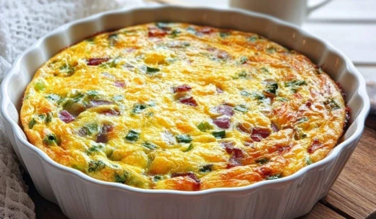 Baked Crustless Quiche with colorful vegetables in a round dish