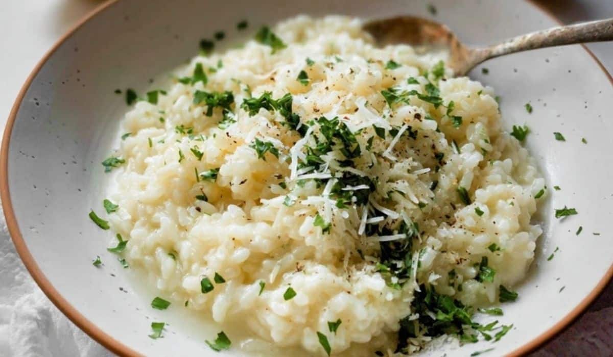 Creamy Parmesan No Wine Risotto in ceramic bowl topped with parsley and cheese