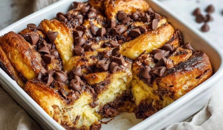 Baked chocolate croissant breakfast bake in white dish