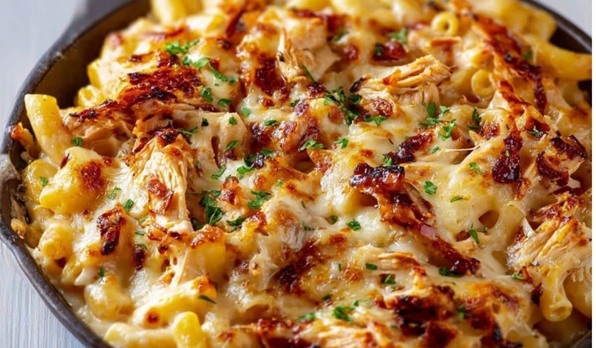 BBQ Chicken Mac and Cheese served in cast iron skillet, melted cheese on top