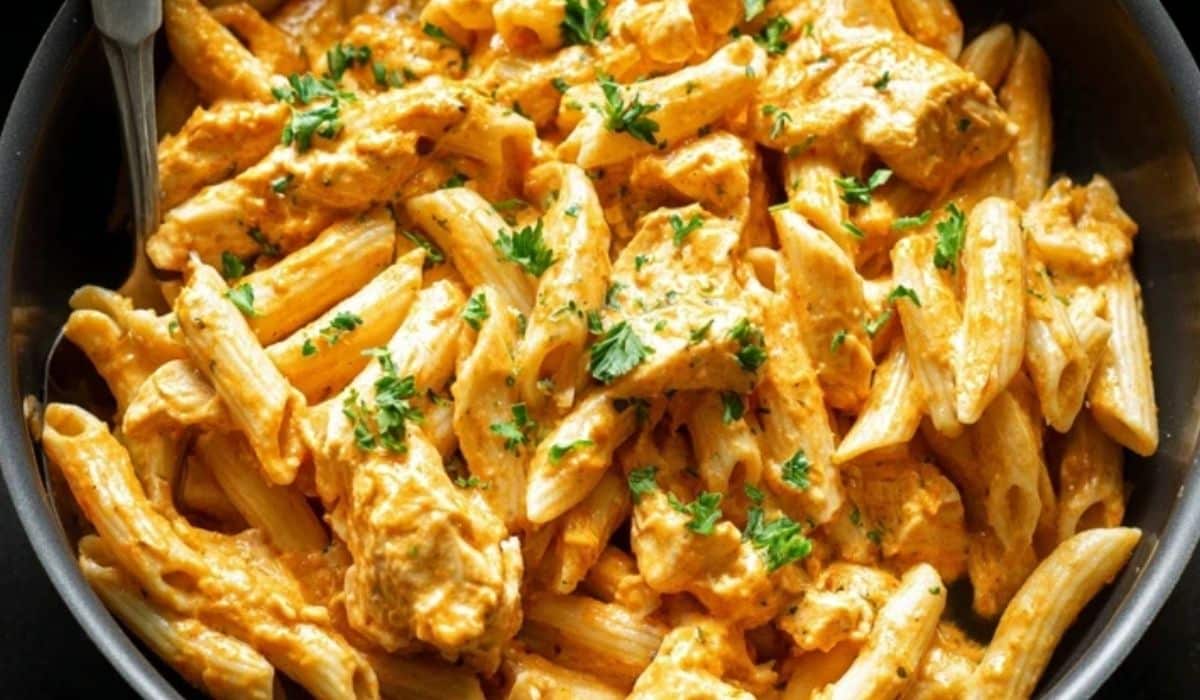 Buffalo Chicken Pasta in creamy buffalo sauce topped with melted cheese and herbs