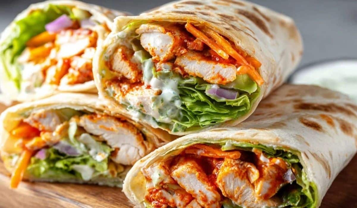 Best Buffalo Chicken Wraps stacked with lettuce and ranch dressing