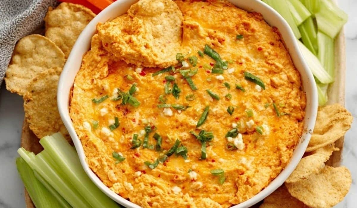 High Protein Buffalo Chicken Dip served with celery and chips