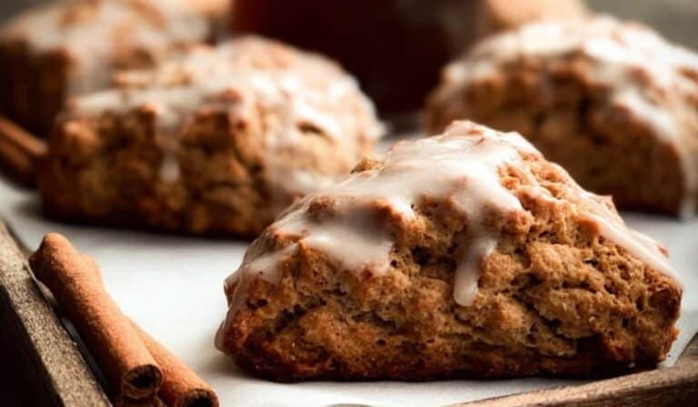 Gingerbread Scones served on a rustic tray with molasses and cinnamon.