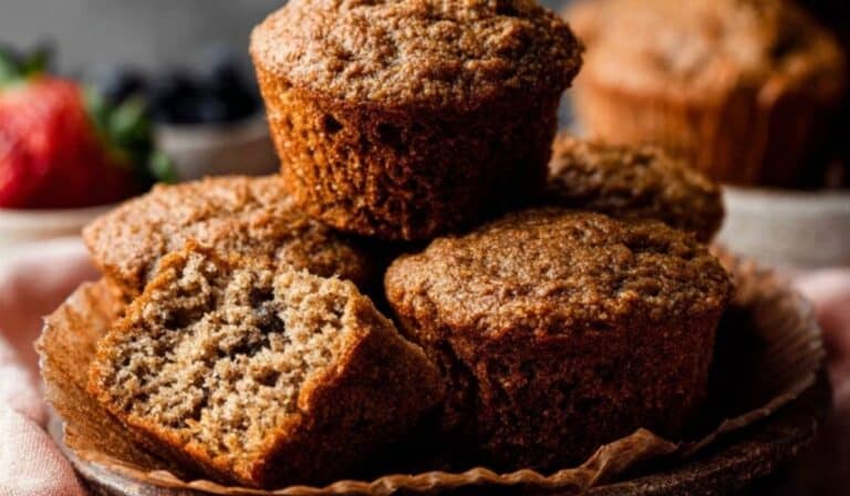 Side angle of Healthy Bran Muffins Recipe served on ceramic plate.
