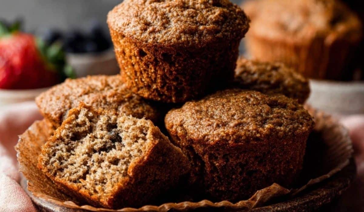 Side angle of Healthy Bran Muffins Recipe served on ceramic plate.