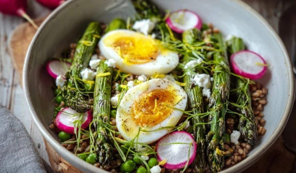 Asparagus and egg spring bowl with quinoa, peas, radishes, and jammy eggs